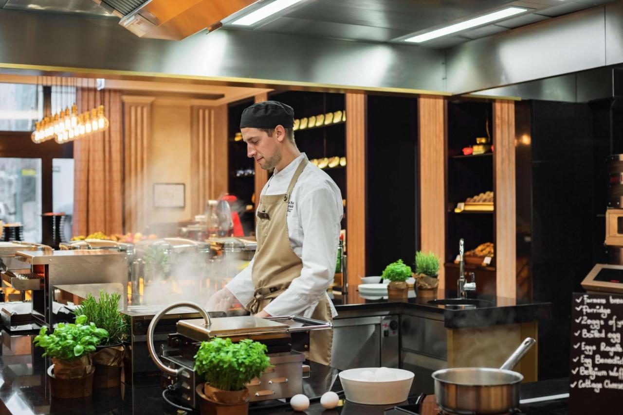 Grand Hotel Kempinski Riga Exterior photo A chef at work